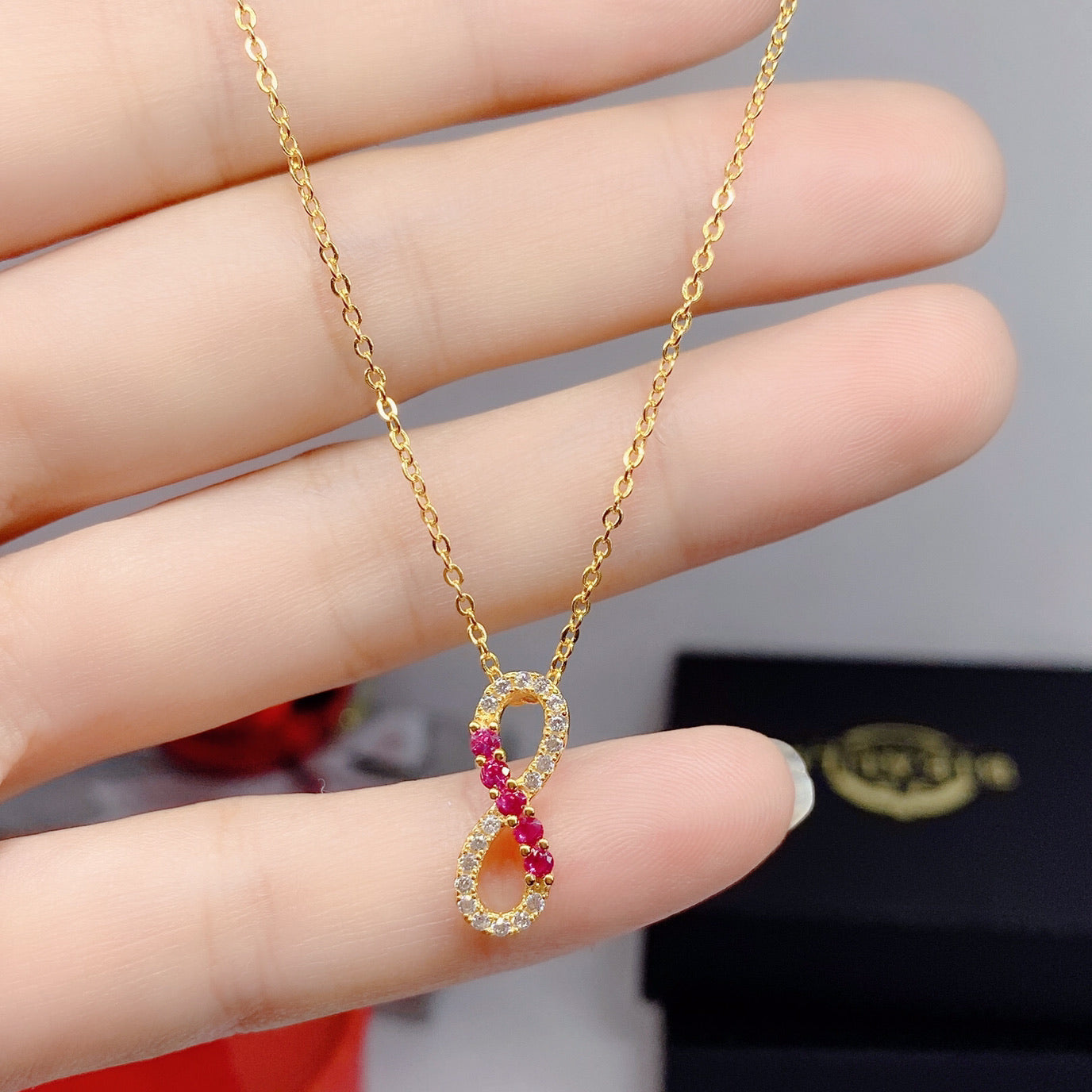 Infinity knot Gold, Ruby & Zirconia Necklace - Bieauli 